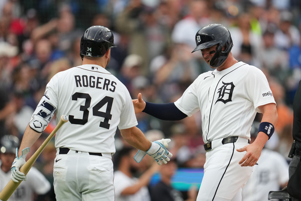 Detroit Tigers' Spencer Torkelson, right, celebrates scoring with Jake Rogers (34) against the New York Yankees during the second inning of a baseball game Wednesday, June 24, 2026, in Detroit. (AP Photo/Paul Sancya)