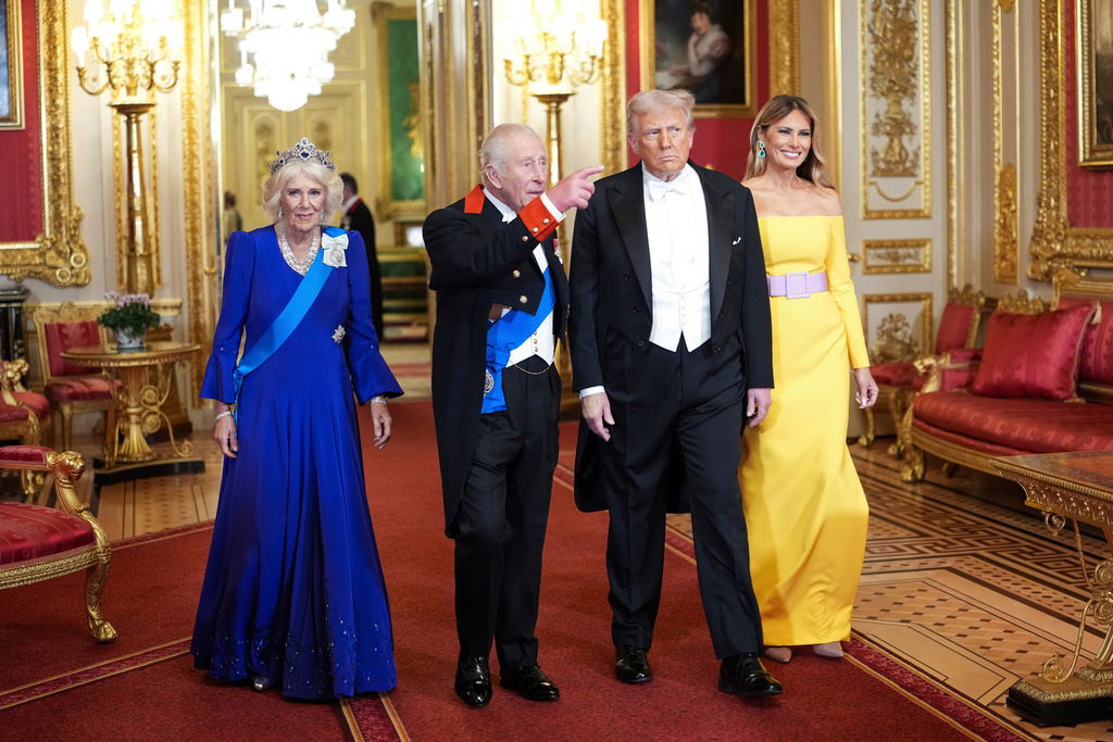 U.S. President Donald Trump and First Lady Melania Trump, right, arrive with Britain's King Charles and Britain's Queen Camilla, for the official state banquet at the Windsor Castle, in Windsor, England, Wednesday, Sept. 17, 2025. (Doug Mills/The New York Times via AP, Pool)