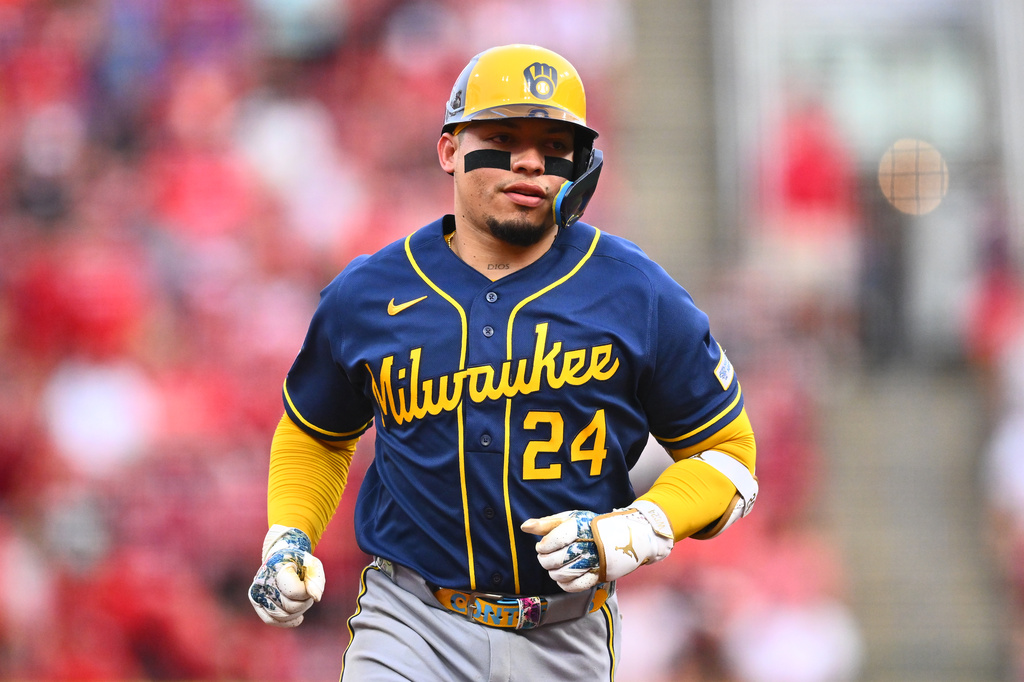 Milwaukee Brewers' William Contreras (24) runs the bases after hitting a two-run home run during the third inning of a baseball game against the Cincinnati Reds in Cincinnati, Wednesday, June 24, 2026. (AP Photo/Ben Jackson)