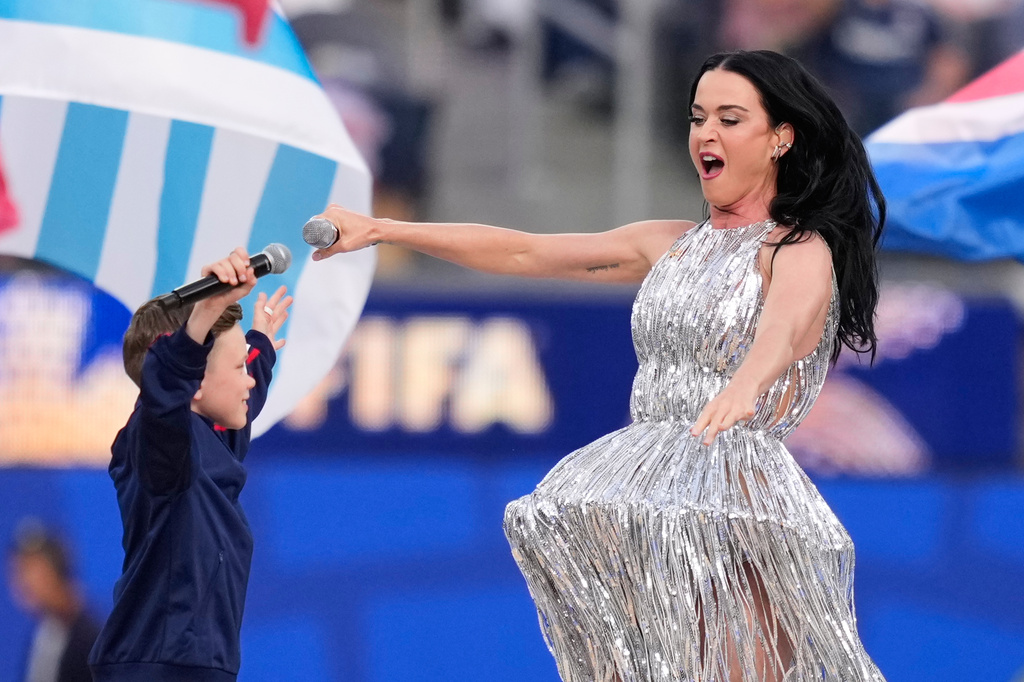 Katy Perry and Tius Luka perform during the opening ceremony ahead of the World Cup Group D soccer match between the United States and Paraguay in Inglewood, Calif., near Los Angeles, Friday, June 12, 2026. (AP Photo/Mark J. Terrill)