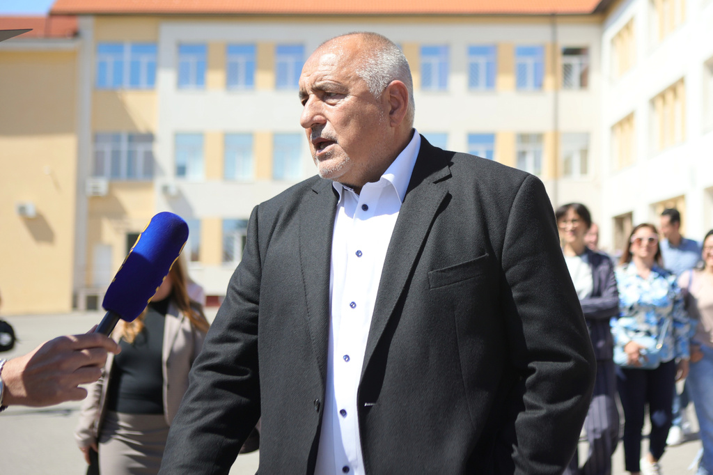Former Prime Minister Boyko Borissov speaks to journalists after casting his vote in a polling station in Bankya, Bulgaria, Sunday, April 19, 2026, during early parliamentary elections. (AP Photo/Valentina Petrova)