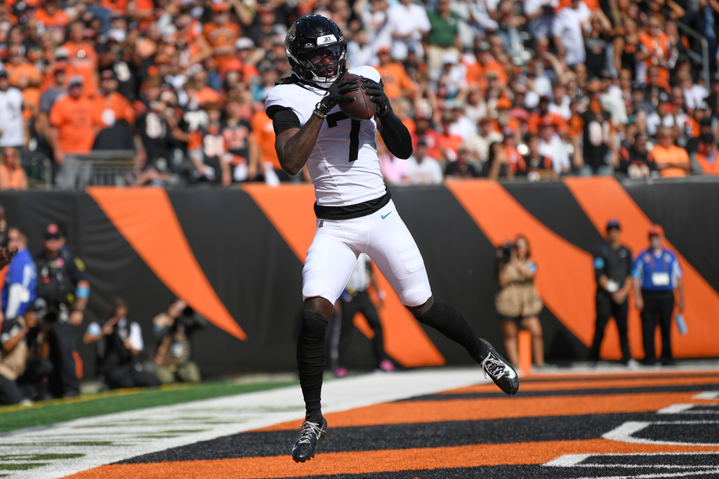 Jacksonville Jaguars wide receiver Brian Thomas Jr. (7) makes a touchdown catch during an NFL football game against the Cincinnati Bengals in Cincinnati, Sunday, Oct. 4, 2026. (AP Photo/Tanner Pearson)