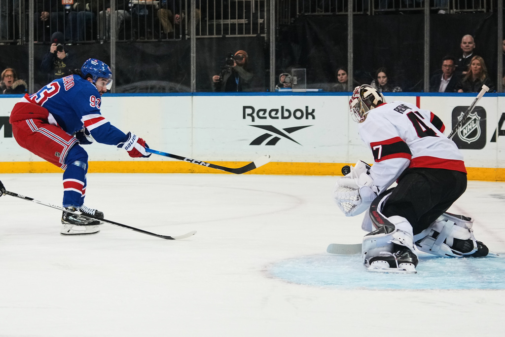 Ottawa Senators goaltender James Reimer (47) stops a shot from New York Rangers' Mika Zibanejad (93) during the second period of an NHL hockey game Monday, March 23, 2026, in New York. (AP Photo/Frank Franklin II)
