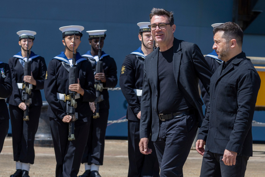 Britain's Prime Minister Andy Burnham, left, and Ukraine's President Volodymyr Zelenskyy visit HM Naval Base in Portsmouth, England, Monday July 27, 2026. (Simon Jones/Pool Photo via AP)