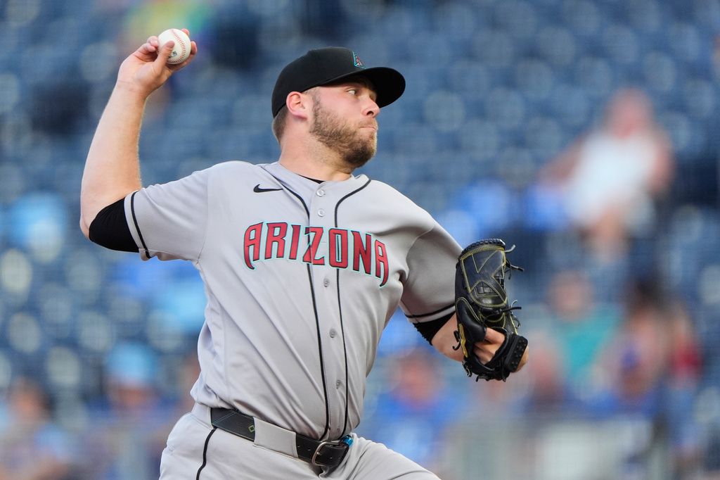 Arizona Diamondbacks starting pitcher Corbin Burnes throws during the first inning of a baseball game against the Kansas City Royals, Tuesday, Sept. 8, 2026, in Kansas City, Mo. (AP Photo/Charlie Riedel)