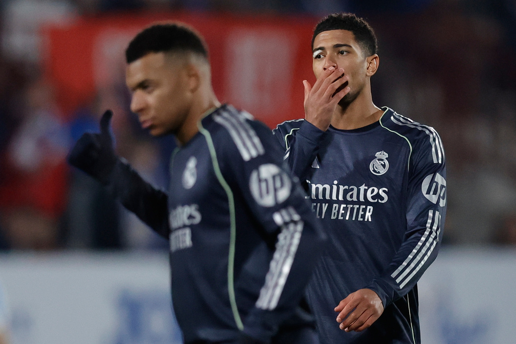Real Madrid's Jude Bellingham, right, reacts next to his teammate Real Madrid's Kylian Mbappe during the Copa del Rey soccer match between Talavera and Real Madrid, in Talavera de la Reina, Spain, Wednesday, Dec. 17, 2025. (AP Photo/M. Berengui)