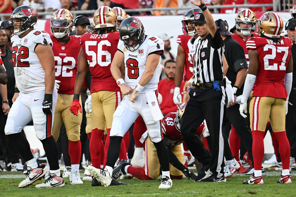 Tampa Bay Buccaneers quarterback Baker Mayfield (6) reacts after running for a first down during the second half of an NFL football game against the San Francisco 49ers in Tampa, Fla., Sunday, Oct. 12, 2025. (AP Photo/Jason Behnken)