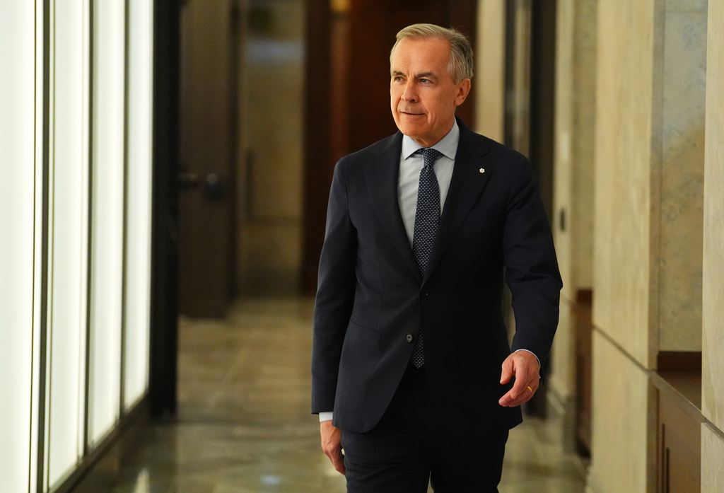 Prime Minister Mark Carney arrives for a news conference in Ottawa on Tuesday, April 14, 2026. (Sean Kilpatrick/The Canadian Press via AP)