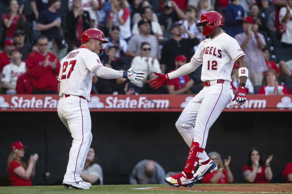 Los Angeles Angels' Mike Trout (27) celebrates with teammate Jorge Soler (12) after Soler's home run during the first inning of a baseball game against the Atlanta Braves, Tuesday, April 7, 2026, in Anaheim, Calif. (AP Photo/Ethan Swope)