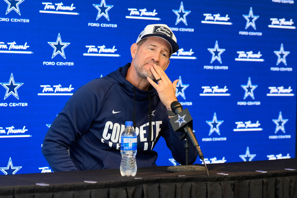 CORRECTS TO THURSDAY, NOV. 13 NOT FRIDAY, NOV. 14 - Dallas Cowboys head coach Brian Schottenheimer pauses as he responds to a question during a news conference before an NFL football practice at the team's headquarters Thursday, Nov. 13, 2025, in Frisco, Texas. (AP Photo/Tony Gutierrez)