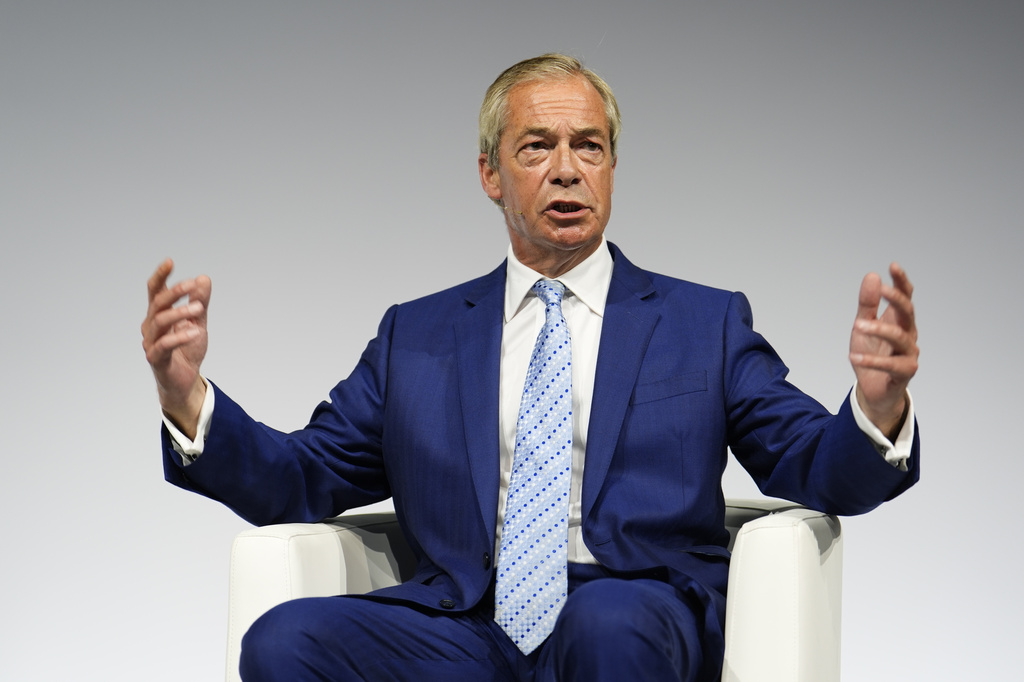 Reform UK leader Nigel Farage gestures during a fireside chat at the Alliance for Responsible Citizenship (Arc) annual conference, at Olympia London, Wednesday June 24, 2026. (Jordan Pettitt/PA via AP)