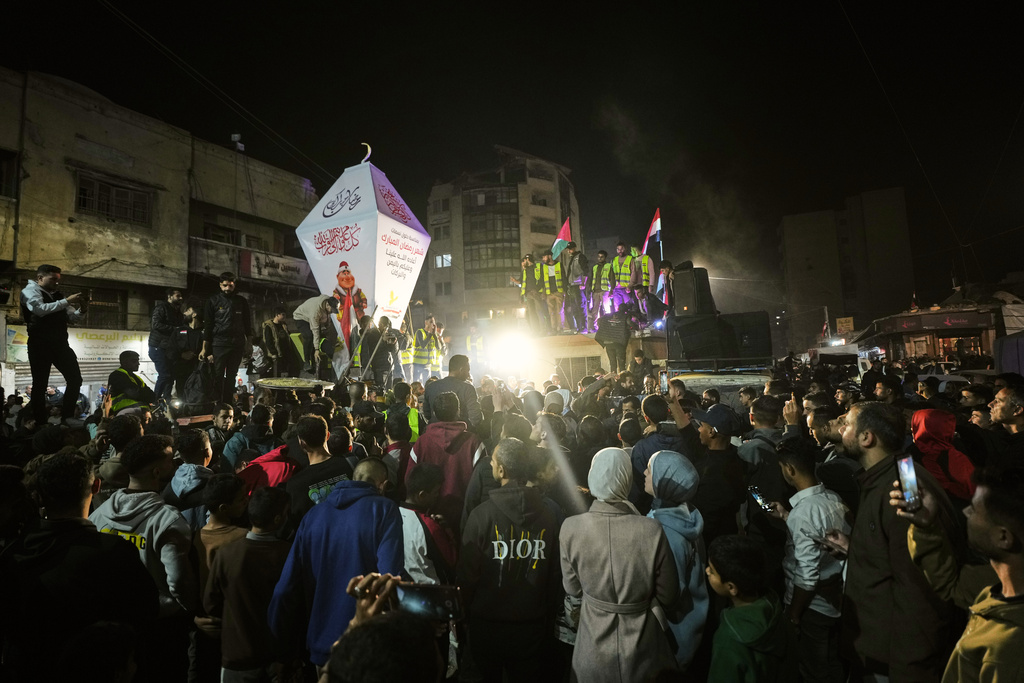Palestinians celebrate the start of the holy fasting month of Ramadan in Gaza City, Tuesday, Feb. 17, 2026. (AP Photo/Jehad Alshrafi)