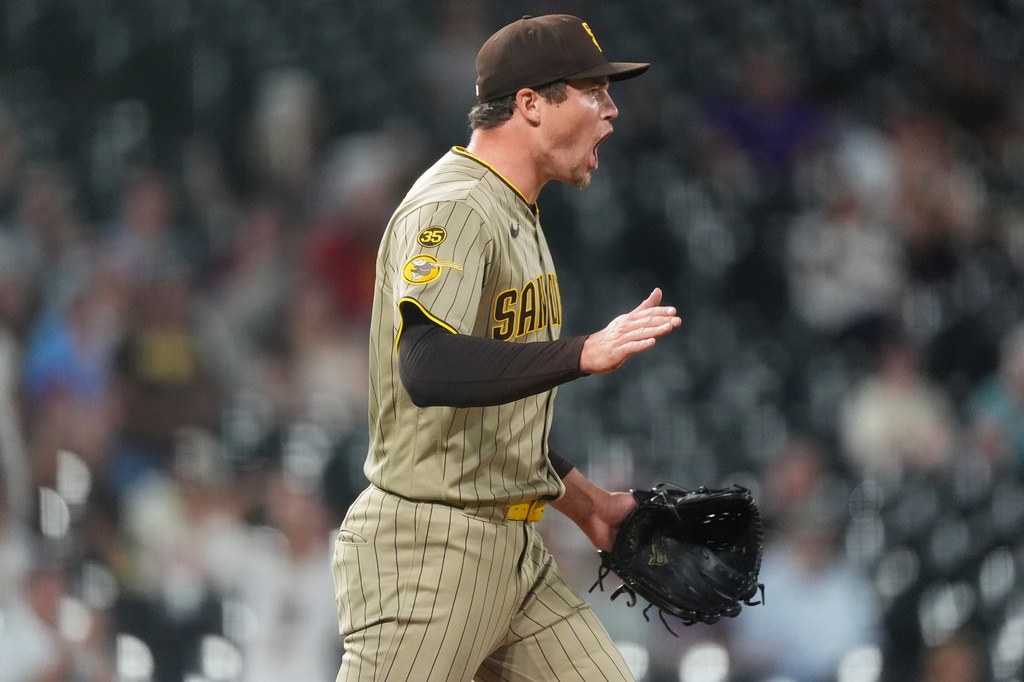 San Diego Padres relief pitcher Mason Miller reacts after third baseman Manny Machado fielded a ground ball and put out Colorado Rockies' Adael Amador to end the ninth inning of a baseball game Monday, Sept. 14, 2026, in Denver. (AP Photo/David Zalubowski)