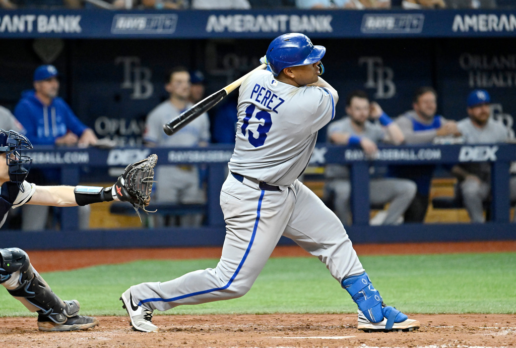 Kansas City Royals' Salvador Perez hits a two-RBI single during the eighth inning of a baseball game against the Tampa Bay Rays Tuesday, June 23, 2026, in St. Petersburg, Fla. (AP Photo/Jason Behnken)