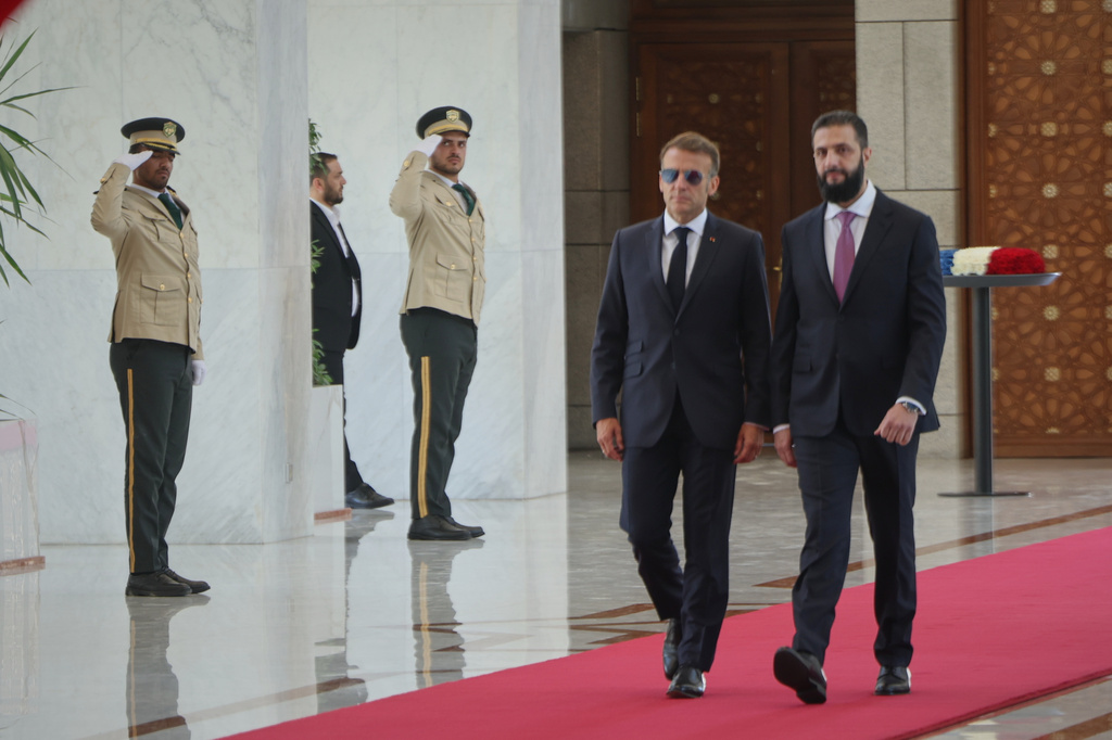 Syrian President Ahmad al-Sharaa, right, meets French President Emmanuel Macron at the presidential palace in Damascus, Syria, Tuesday, July 7, 2026. (AP Photo/Ghaith Alsayed)