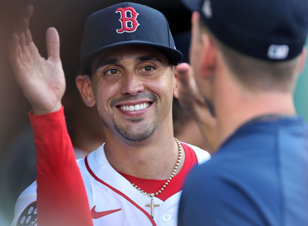 Boston Red Sox starting pitcher Jose De Leon smiles as he is greeted by teammates in the dugout after being removed in the top of the seventh inning during a baseball game against the Detroit Tigers, Sunday, Sept. 28, 2025, in Boston. (AP Photo/Jim Davis)