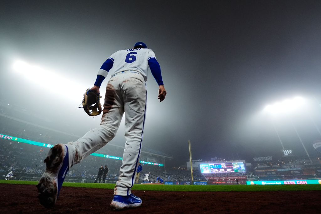 Kansas City Royals' Jonathan India (6) jogs onto the field during the fourth inning of a foggy baseball game against the Minnesota Twins, Wednesday, April 1, 2026, in Kansas City, Mo. (AP Photo/Charlie Riedel)