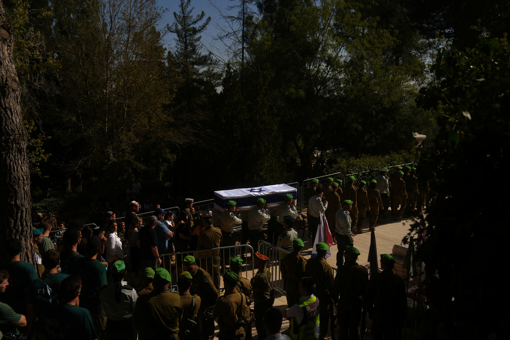 Israeli servicemen carry the coffin of comrade Major Yaniv Kola, who was killed in the Gaza Strip, during his funeral at Mt. Herzl military cemetery in Jerusalem, Monday, Oct. 20, 2025. (AP Photo/Francisco Seco)