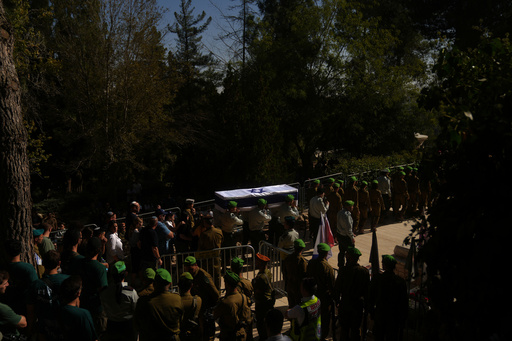 Israeli servicemen carry the coffin of comrade Major Yaniv Kola, who was killed in the Gaza Strip, during his funeral at Mt. Herzl military cemetery in Jerusalem, Monday, Oct. 20, 2025. (AP Photo/Francisco Seco) Israeli servicemen carry the coffin of comrade Major Yaniv Kola, who was killed in the Gaza Strip, during his funeral at Mt. Herzl military cemetery in Jerusalem, Monday, Oct. 20, 2025. (AP Photo/Francisco Seco)
