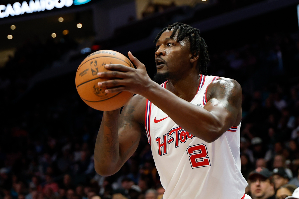 FILE - Houston Rockets forward Dorian Finney-Smith shoots against the Charlotte Hornets during the first half of an NBA basketball game in Charlotte, N.C., Feb. 19, 2026. (AP Photo/Nell Redmond, File)