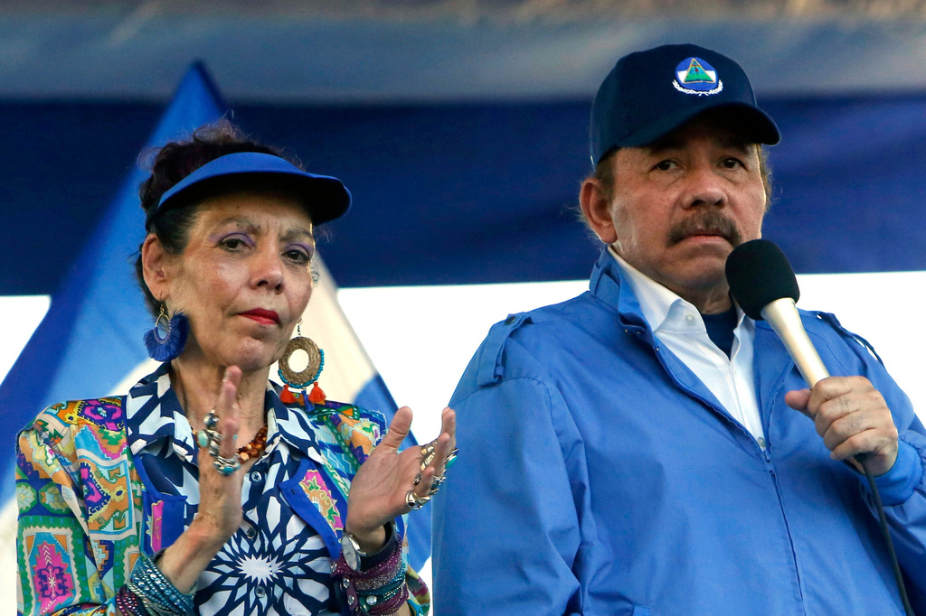 FILE - Nicaraguan President Daniel Ortega and his wife, Vice President Rosario Murillo, lead a rally in Managua, Nicaragua, Sept. 5, 2018. (AP Photo/Alfredo Zuniga, File)