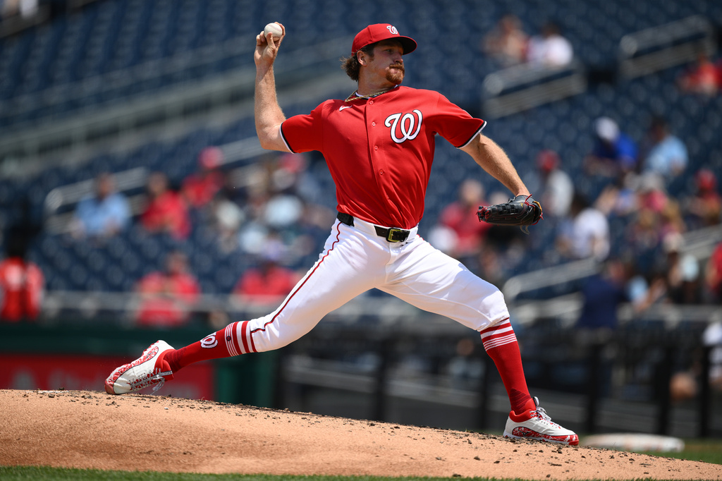 Washington Nationals pitcher Miles Mikolas throws during the third inning of a baseball game against the Seattle Mariners, Sunday, June 14, 2026, in Washington. (AP Photo/Nick Wass)