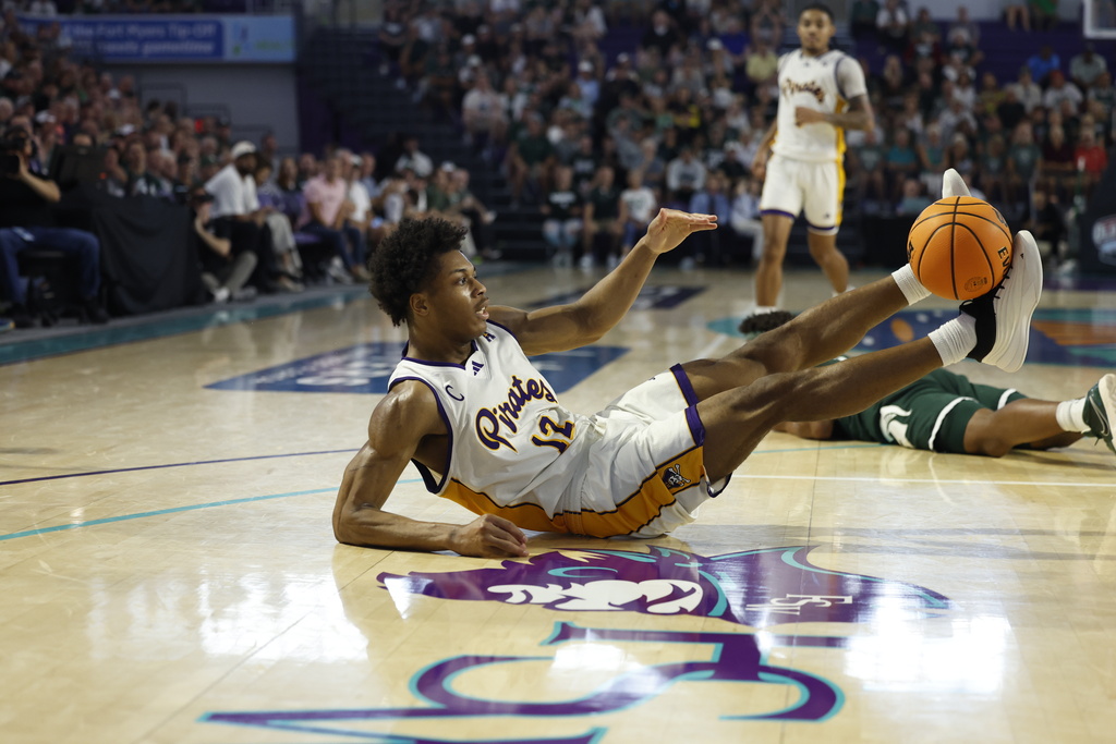 East Carolina guard Jordan Riley loses control of the ball against the Michigan State during the first half of an NCAA college basketball game, Tuesday, Nov. 25, 2025 in Ft. Myers, Fla. (AP Photo/Scott Audette)