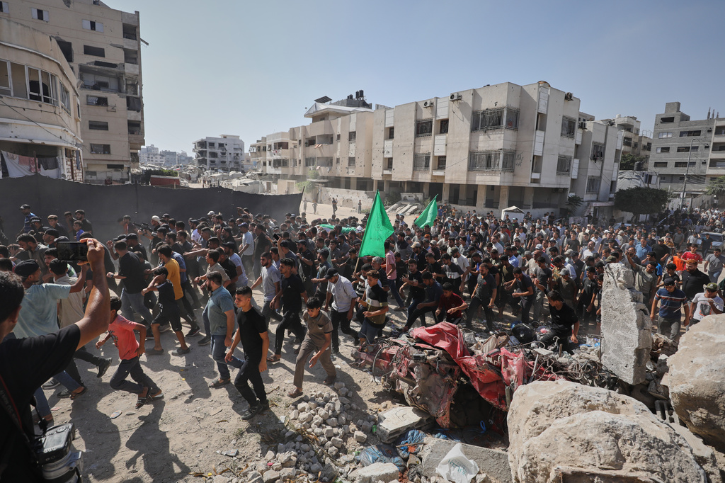 Palestinians carry the body of Ahmad Al-Batsh, a Qassam Brigades commander in Jabaliya, the military wing of Hamas, during his funeral after he was killed in an Israeli airstrike, in Gaza City, Tuesday, Sept. 15, 2026. (AP Photo/Yousef Al Zanoun)