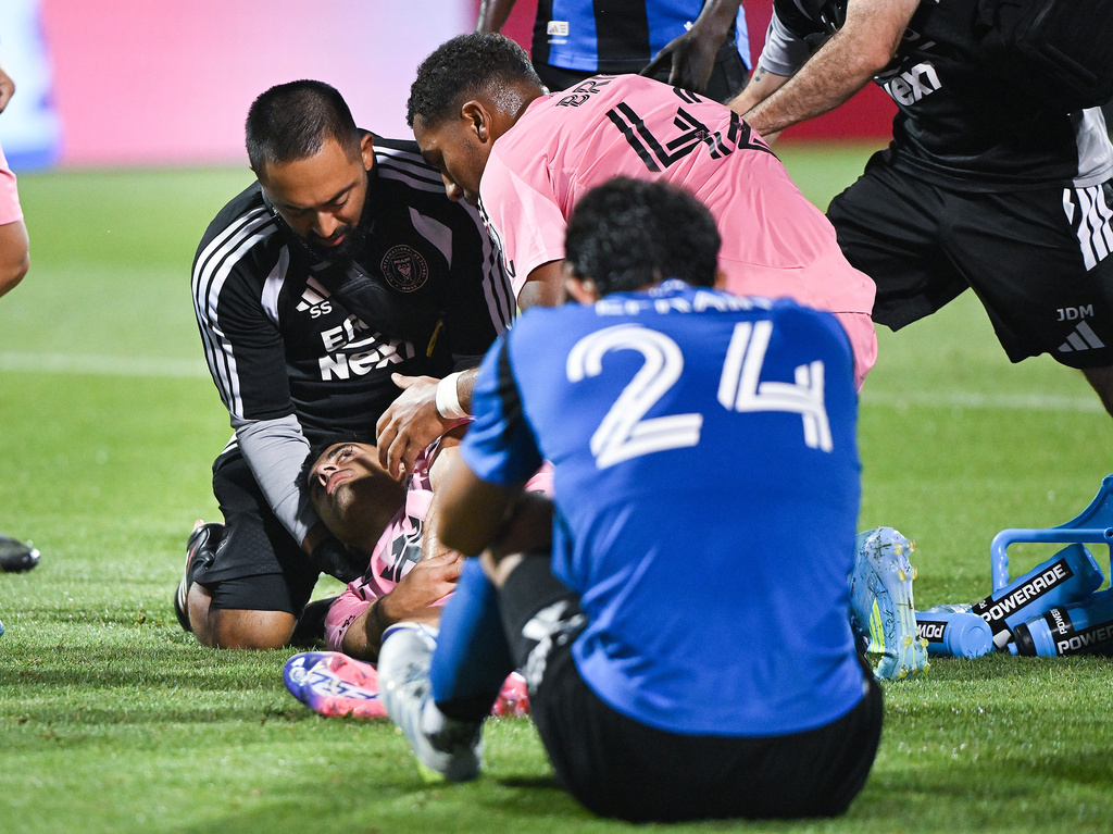Inter Miami CF's German Berterame is tended to by medical staff after colliding with CF Montreal's Efrain Morales (24) during second half MLS soccer action in Montreal, on Saturday, July 25, 2026. Berterame was taking off the pitch via ambulance. (Graham Hughes/The Canadian Press via AP)
