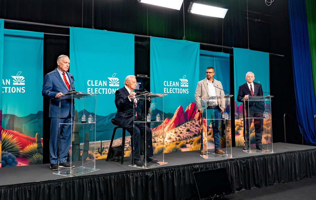 Rep. Andy Biggs, R-Ariz., left, Ken Miceli, second from left, Scott Neely and Rep. David Schweikert, R-Ariz., right, stand on the stage in the 2026 AZ Clean Elections Republican governor primary debate, Wednesday, June 17, 2026, in Scottsdale, Ariz. (Diannie Chavez/The Arizona Republic via AP, Pool)