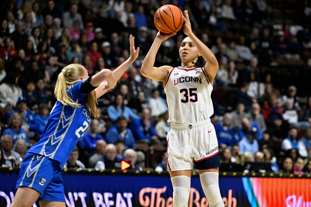 UConn guard Azzi Fudd (35) shoots over Creighton guard Ava Zediker during second half of an NCAA college basketball game in the semifinals of the Big East tournament, Sunday, March 8, 2026, in Uncasville, Conn. (AP Photo/Jessica Hill)