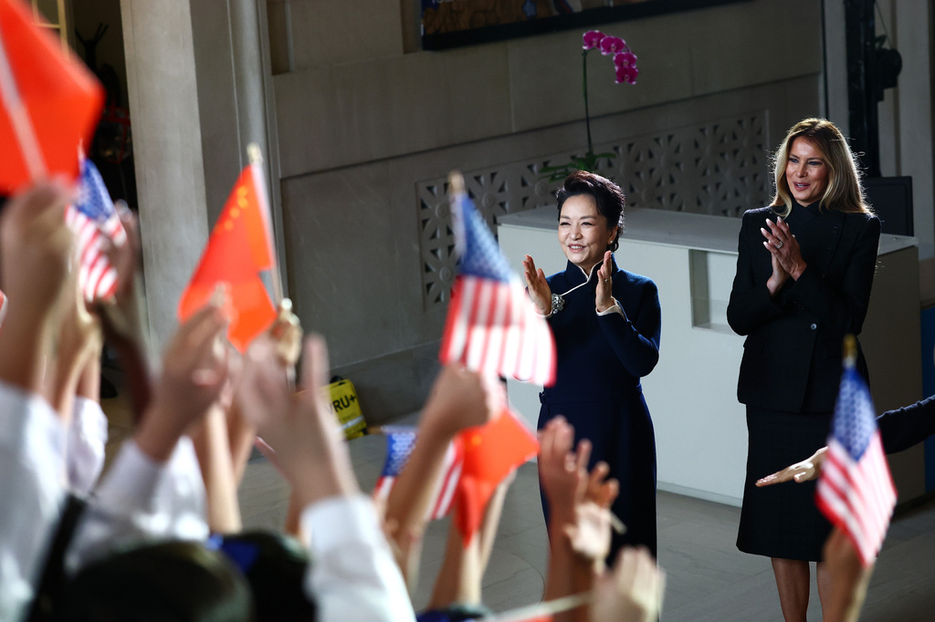 First lady of China Peng Liyuan, left, and first lady Melania Trump react as children perform during a visit to the Smithsonian's National Museum Of Asian Art, Thursday, Sept. 24, 2026, in Washington. (Finn Gomez/Pool Photo via AP)