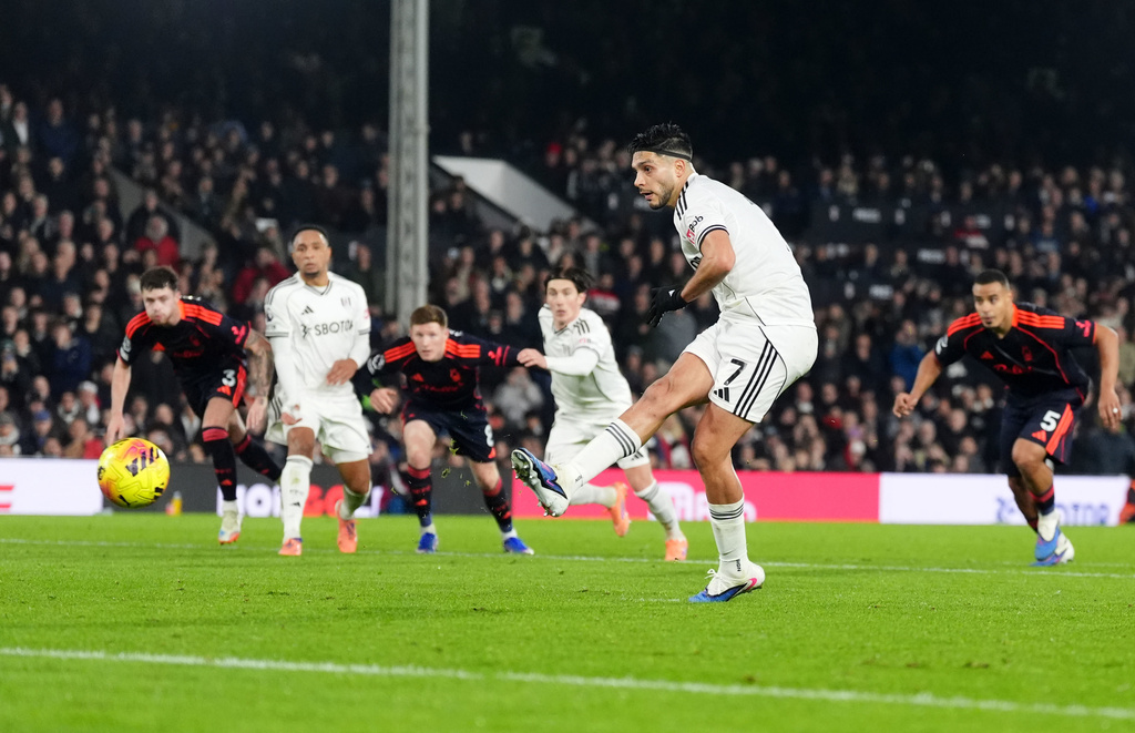 Fulham's Raul Jimenez scores their side's first goal of the game from a penalty during the Premier League match between NottinghamForest and Fulham, in London, Monday Dec. 22, 2025. (Adam Davy/PA via AP)