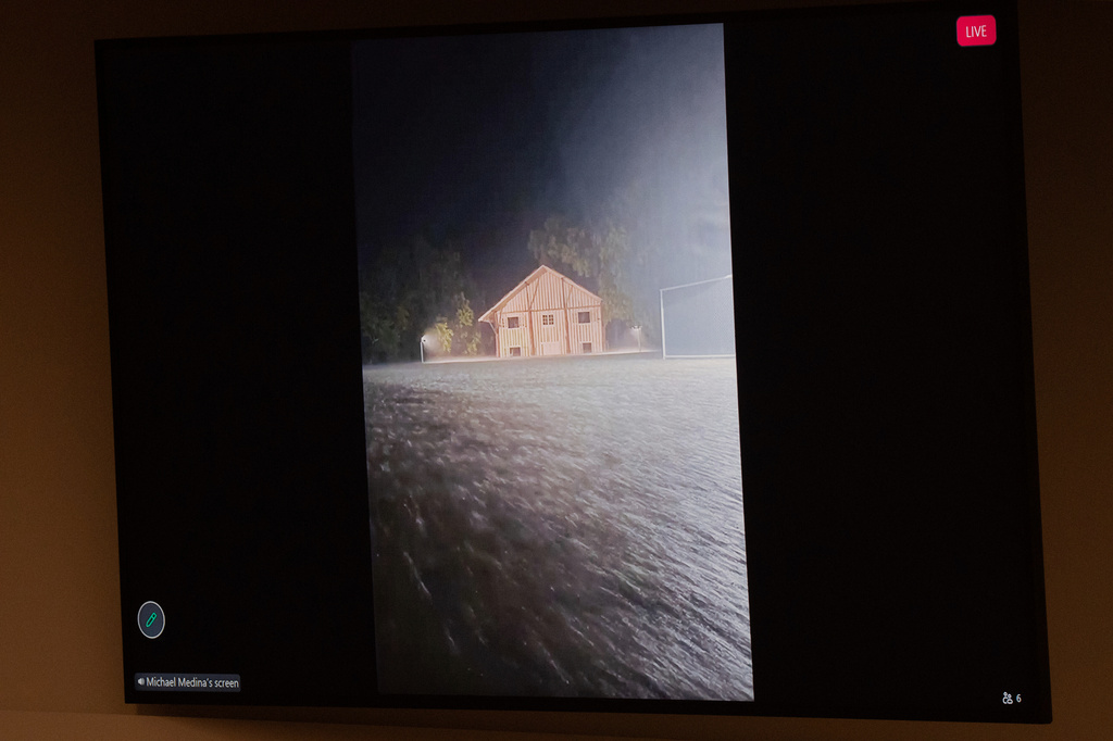 A photo of the July 4 flood at Camp Mystic is submitted into evidence during a hearing on a suit against Camp Mystic, in the 459th State District Court, in Austin, Texas, Monday, April 13, 2026. (Mikala Compton/Austin American-Statesman via AP)