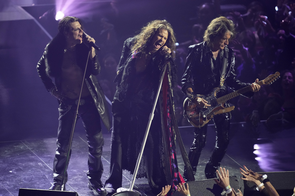 Yungblud, from left, Steven Tyler, and Joe Perry perform a tribute to Ozzy Osbourneduring the MTV Video Music Awards on Sunday, Sept. 7, 2025, at UBS Arena in Elmont, N.Y. (Photo by Charles Sykes/Invision/AP)