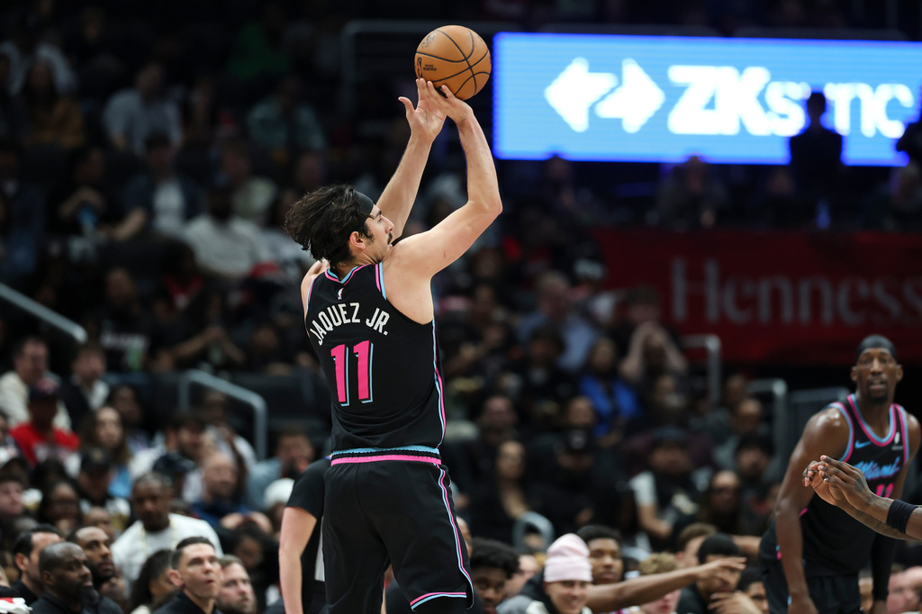 Miami Heat forward Jaime Jaquez Jr. (11) shoots a 3-point basket during the first half of an NBA basketball game against the Washington Wizards, Friday, April 10, 2026, in Washington. (AP Photo/Terrance Williams)