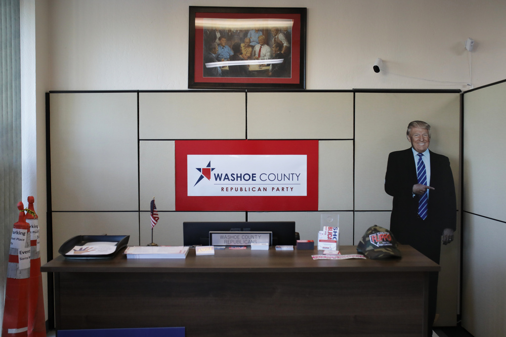 A cutout of President Donald Trump stands near a Washoe County Republican Party sign and desk during a primary election night watch party for David Flippo, a Republican candidate for Congress in Nevada's 2nd district, Tuesday, June 9, 2026, in Reno, Nev. (AP Photo/William Hale Irwin)