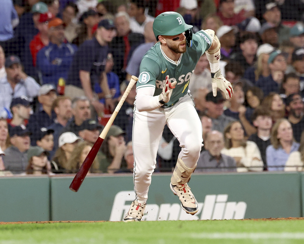 Boston Red Sox's Trevor Story starts to run to first base on a flyout during the fourth inning of a baseball game against the New York Yankees, Friday, Sept. 12, 2025, in Boston. (AP Photo/Mark Stockwell)