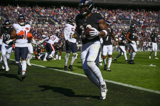 Baltimore Ravens running back Derrick Henry (22) runs in a touchdown during the first half an NFL football game against the Chicago Bears, Sunday, Oct. 26, 2025, in Baltimore. (AP Photo/Nick Wass) Baltimore Ravens running back Derrick Henry (22) runs in a touchdown during the first half an NFL football game against the Chicago Bears, Sunday, Oct. 26, 2025, in Baltimore. (AP Photo/Nick Wass)