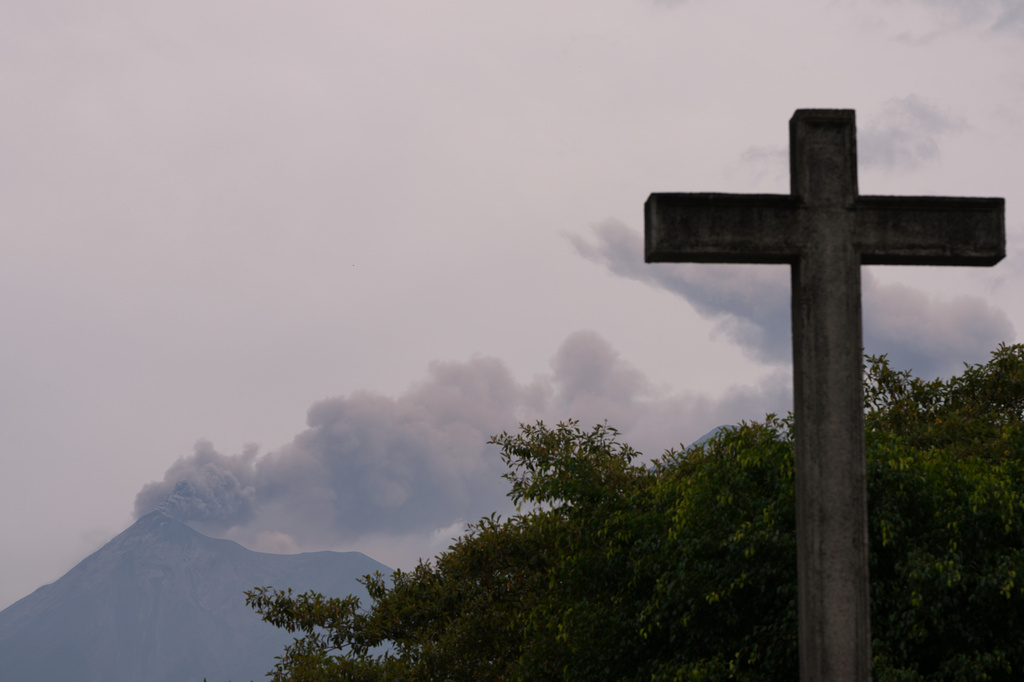 Clouds of ash spew from crater of the Fuego volcano, as seen from San Pedro Las Huertas, Guatemala, Tuesday, Aug. 4, 2026. (AP Photo/Moises Castillo)