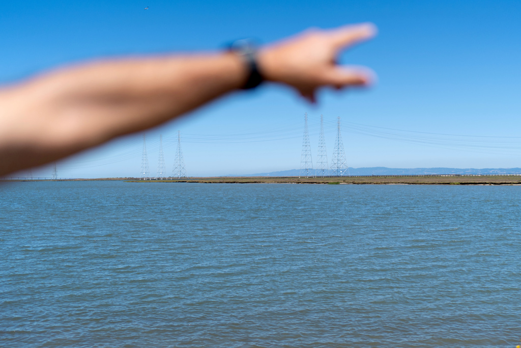 Christy Morrill, who had to give up kayaking for a time when he was experiencing seizures from autoimmune encephalitis, looks over the waters where he used to paddle in San Francisco Bay, Monday, Aug. 18, 2025, in Redwood City, Calif. (AP Photo/David Goldman)