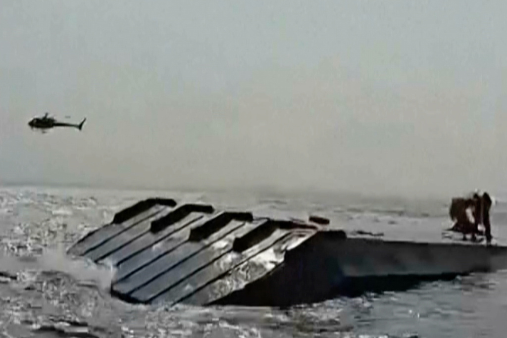 In this image taken from a video people are rescued from an overloaded ferry that capsized on Zimbabwe's Lake Kariba on Tuesday, Aug. 11, 2026. (Maxton Kanhema via AP)