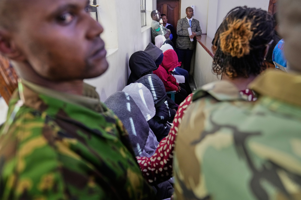 Nine students from Utumishi Girls Academy appear at Naivasha Law Courts in Nakuru, Kenya, Tuesday, June 2, 2026. (AP Photo/Brian Inganga)