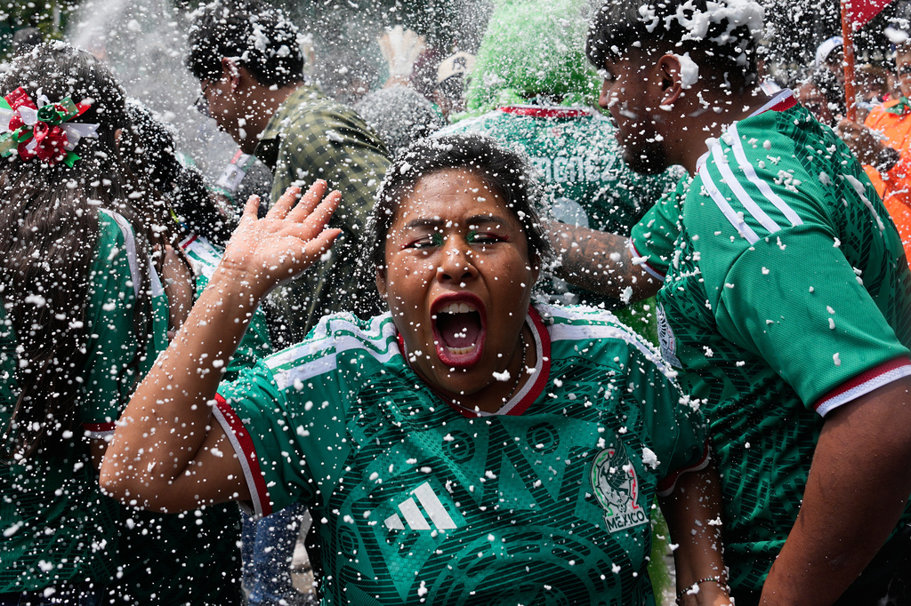 Soccer fans get revved up at a watch party on Reforma Ave., near the Angel of Independence monument, for the World Cup soccer match between Mexico and Ecuador, in Mexico City, Tuesday, June 30, 2026. (AP Photo/Marco Ugarte)