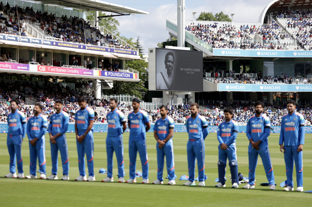 India players stand for a minute of silence in tribute to late cricketer Garfield Sobers at the start of the third ODI between England and India, at Lord's cricket ground, London, Sunday, July 19, 2026. (Steven Paston/PA via AP)