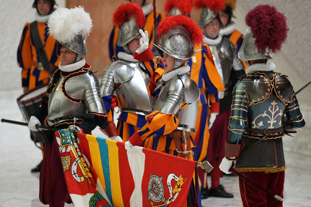 A cadet recites the oath during the swearing in ceremony for 28 new Pontifical Swiss Guards in the Paul VI Hall at the Vatican, Wednesday, May 6, 2026. (AP Photo/Andrew Medichini)