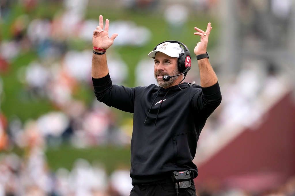 Utah head coach Morgan Scalley calls for a touchdown during a video replay in the first half of an NCAA college football game against Iowa State, Saturday, Sept. 26, 2026, in Ames, Iowa. (AP Photo/Charlie Neibergall)