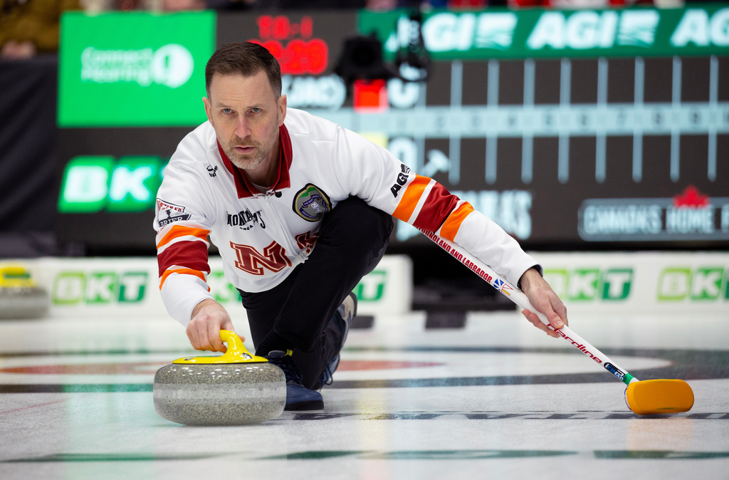 FILE - Brad Gushue, skip of Team Newfoundland and Labrador-Gushue, delivers his stone during Draw 17 at the Montana's Brier Canadian men's curling championship in St. John's, N.L., March 5, 2026. (Paul Daly/The Canadian Press via AP, File)