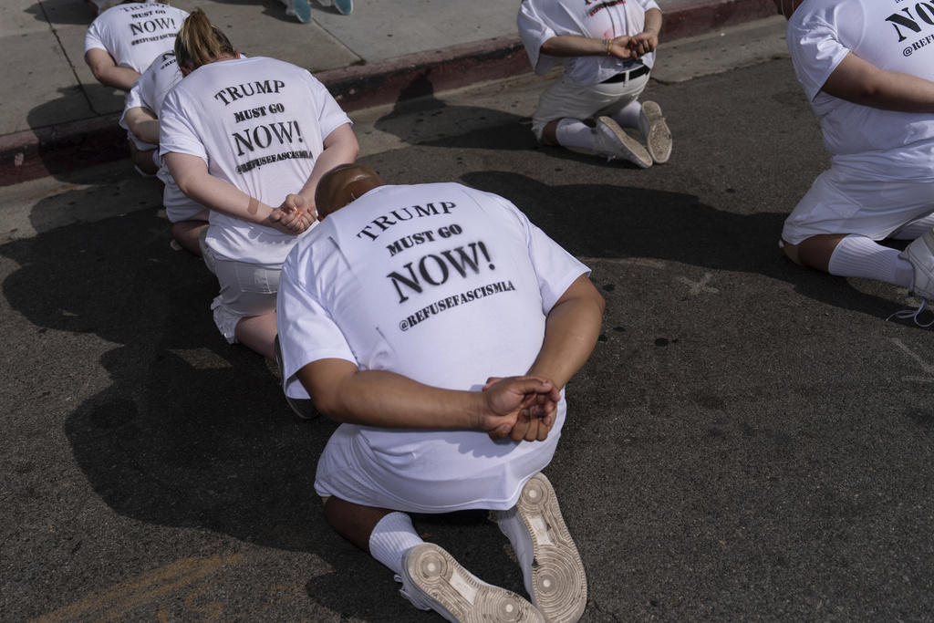 Participants take part in a human art installation depicting immigrants in detention during a demonstration outside the federal building in Los Angeles, Thursday, July 17, 2025, amid ongoing ICE raids. (AP Photo/Jae C. Hong)