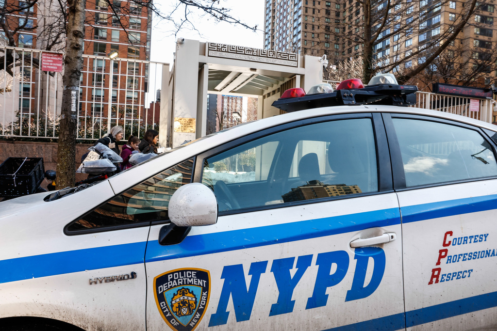 NYPD cars are seen outside the Slamic Cultural Center of New York, Saturday, Feb. 28, 2026, in New York. (AP Photo/Kena Betancur)